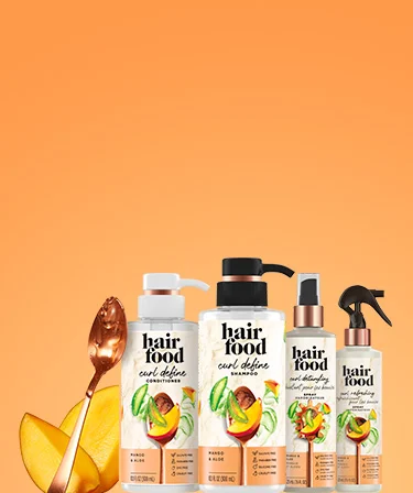 Hair Food Curl Define Collection Products on an orange background.