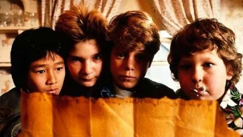 four kids reading an old transcript