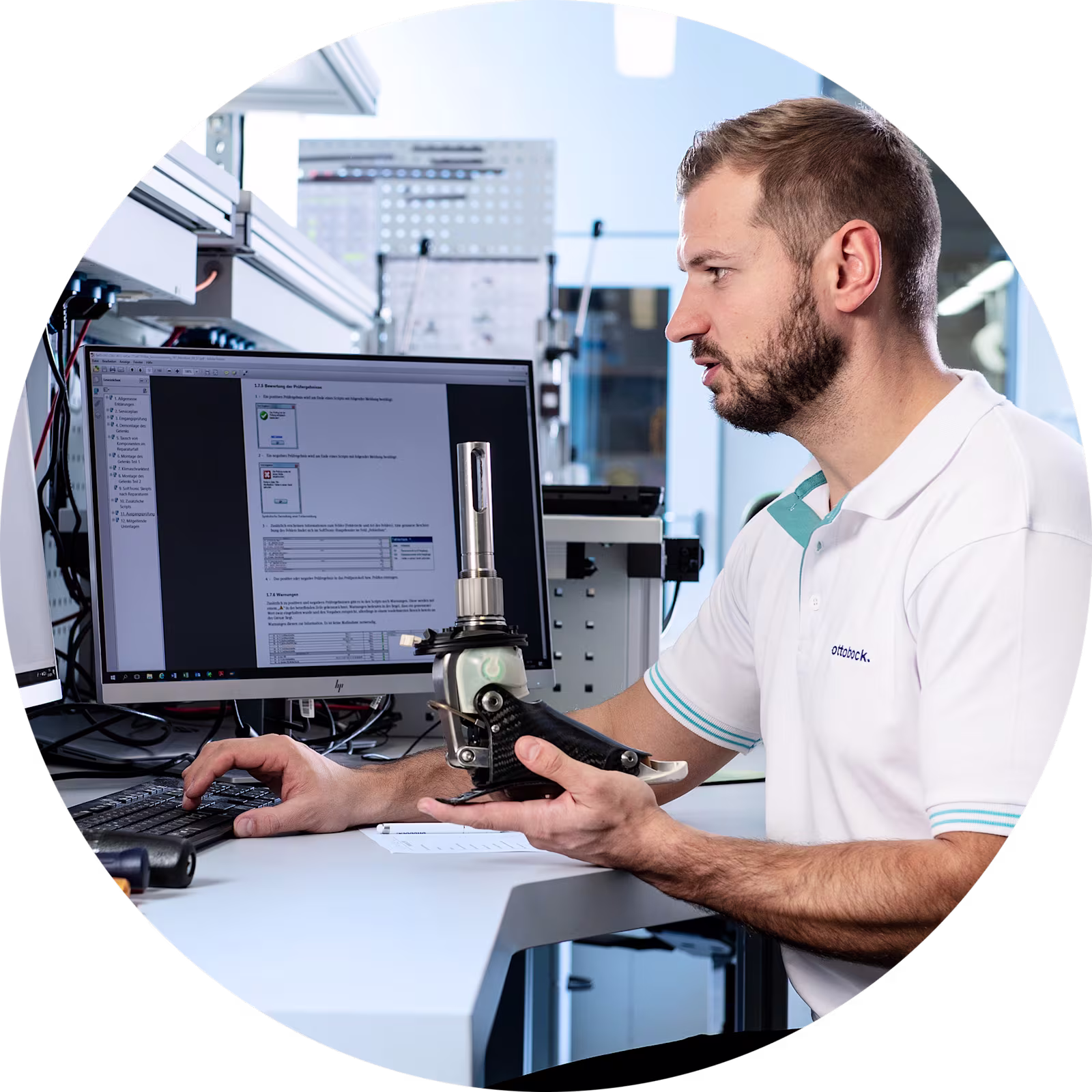 Product support technician holding a prosthetic foot looking up specifications.