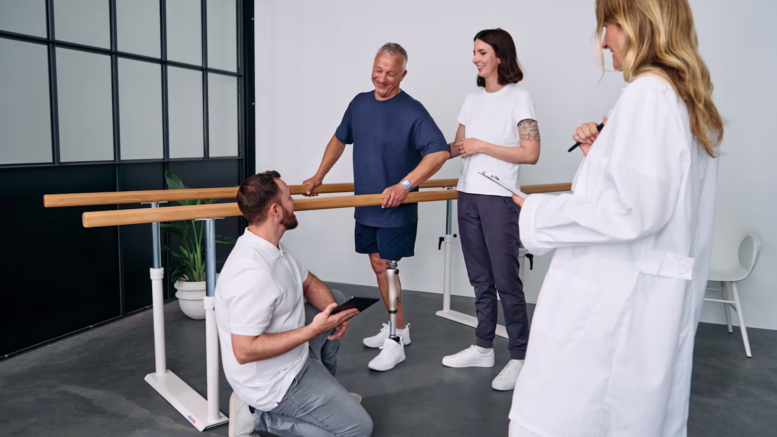 An above-knee amputee testing the Kenevo microprocessor-controlled knee by Ottobock at an orthotics & prosthetics clinic