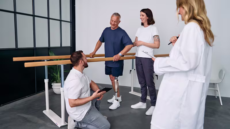 An above-knee amputee testing the Kenevo microprocessor-controlled knee by Ottobock at an orthotics & prosthetics clinic