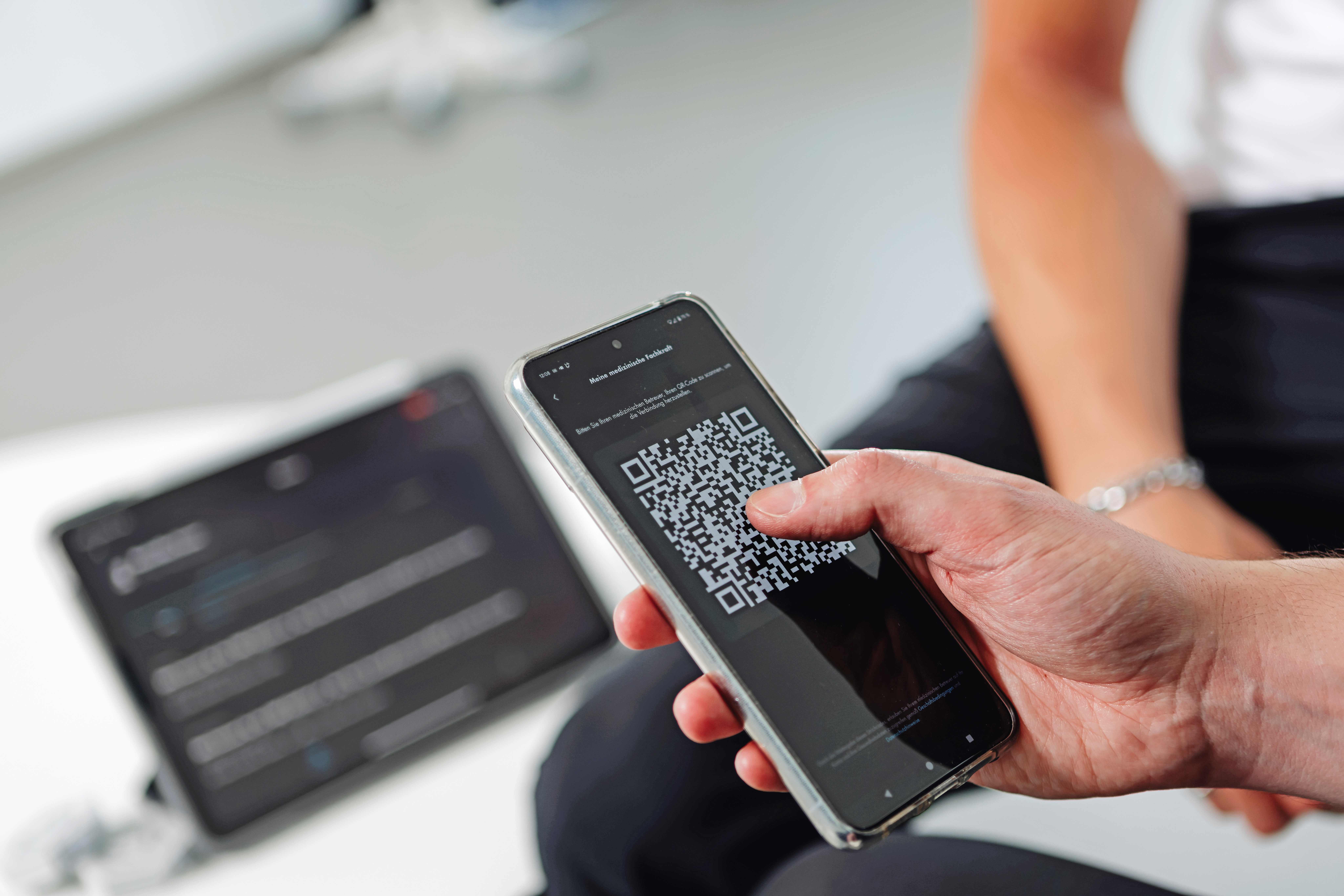 Close-up of the exopulse suit app for users.