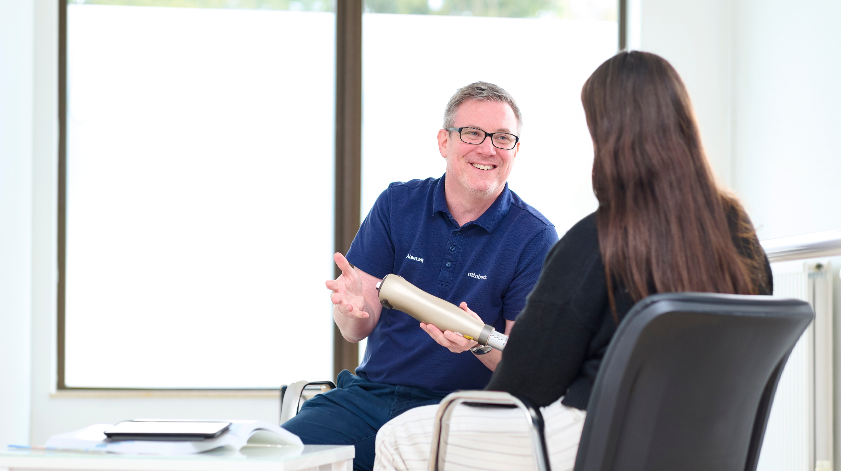 Ottobock Academy Clinician Alastair Ward holding a Kenevo prosthetic MPK.