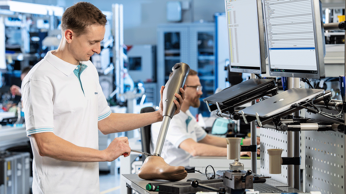 A Prosthetist Technical Specialist fixing a prosthetic foot