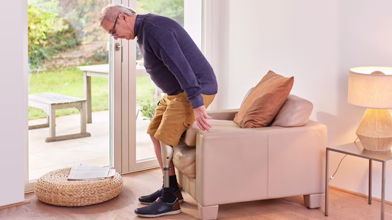 Prosthetic user Robert with Kenevo is sitting down