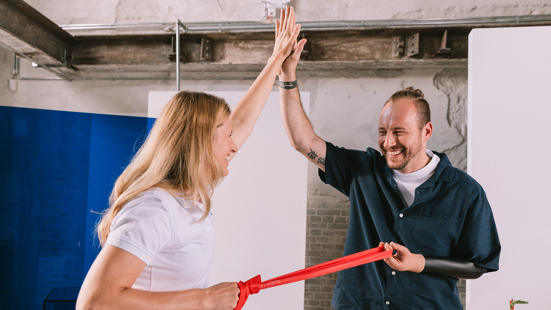 Sebastian is training with his physiotherapist the usage of his prosthetic arm.