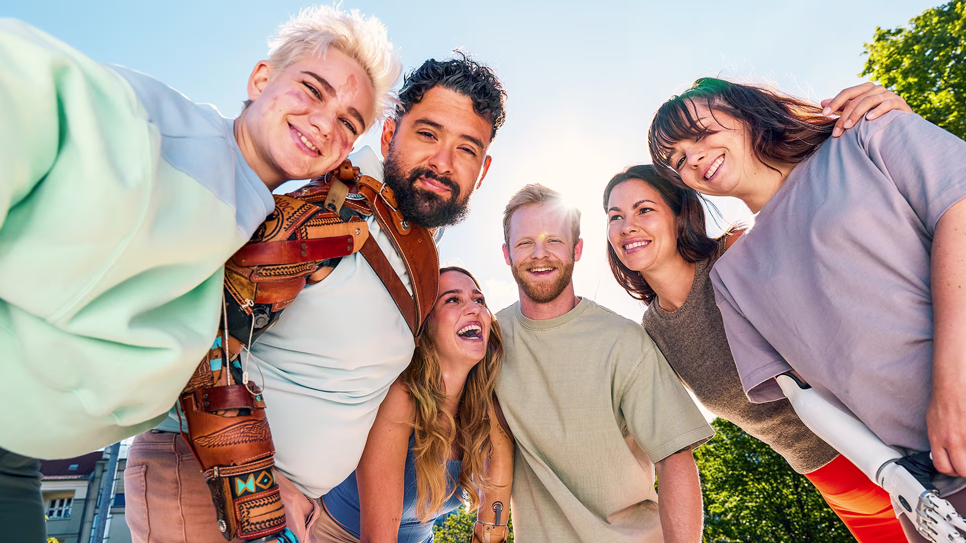 A diverse group of amputees enjoy each others company while wearing various custom bionic hand products