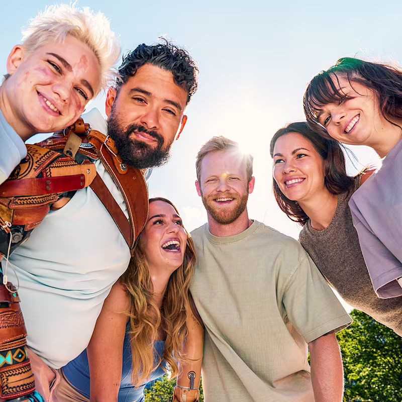 A diverse group of amputees enjoy each others company while wearing various custom bionic hand products
