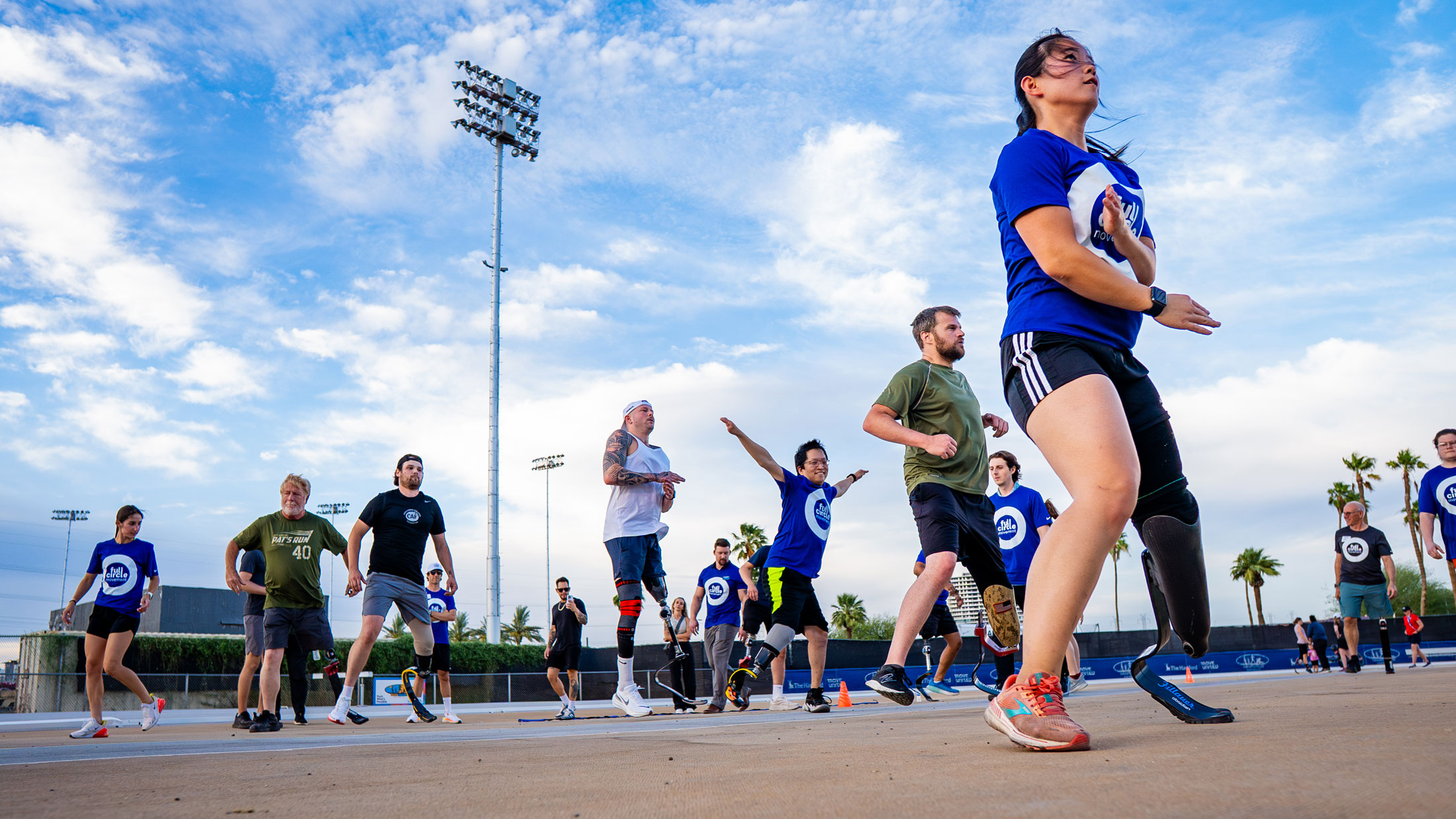 Adaptive athletes doing warm ups on an outdoor court in Tempe, AZ