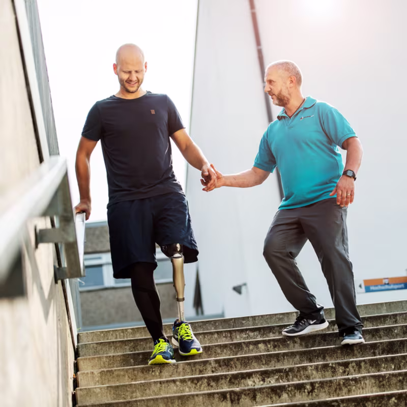 Prosthetic user during gait training outdoor