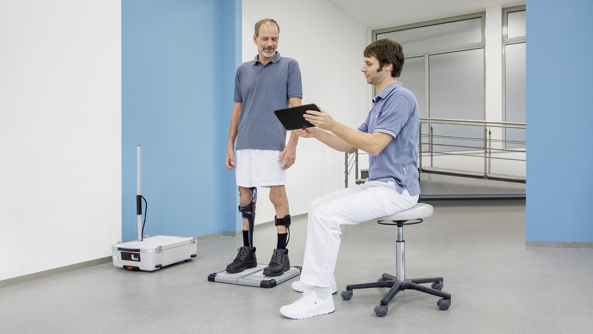 A Certified Orthotist reviewing the gait of a patient in the C-Brace