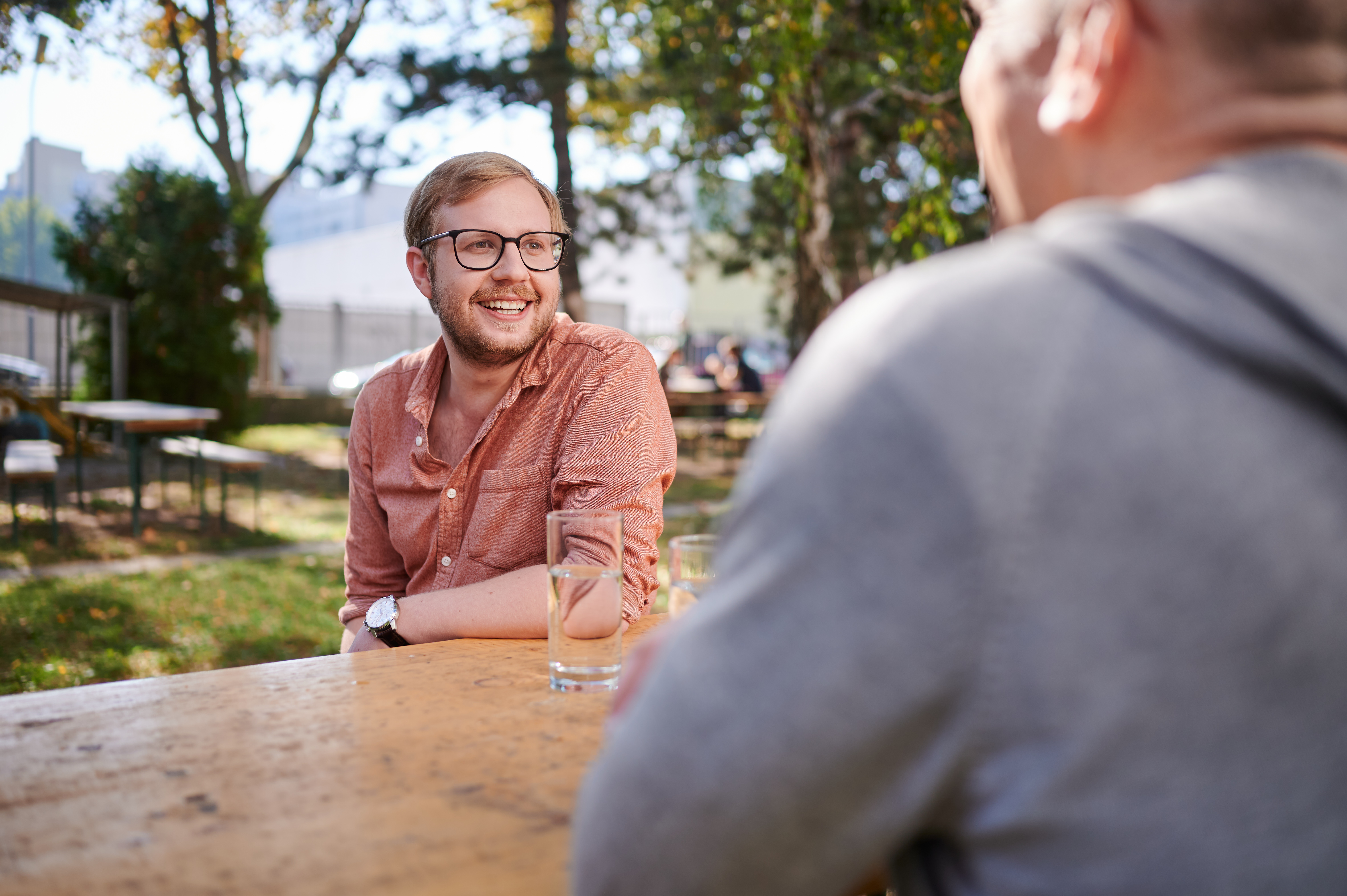 Two friends enjoying a conversation outside 