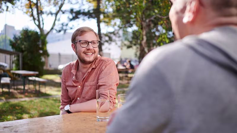Two friends enjoying a conversation outside