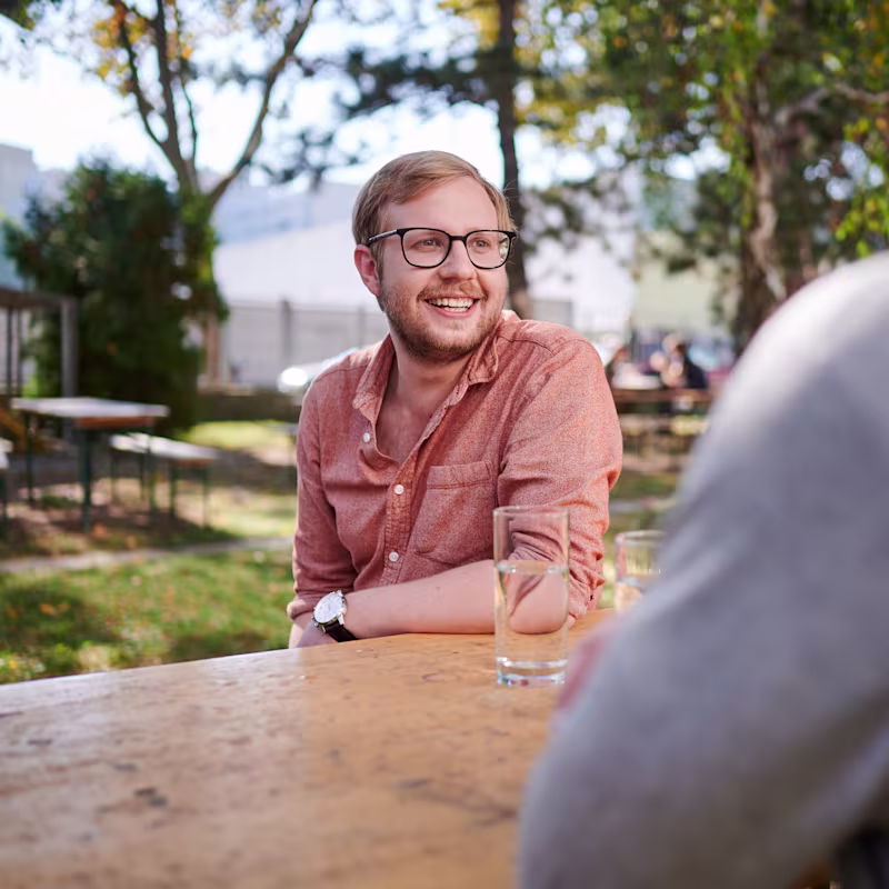 Two friends enjoying a conversation outside