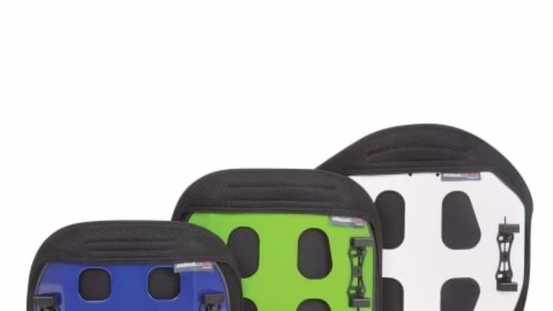 Three wheelchair backrests in blue, green, and white with ergonomic rigid shells, padded black edges, and cutout designs for lightweight support and easy handling.