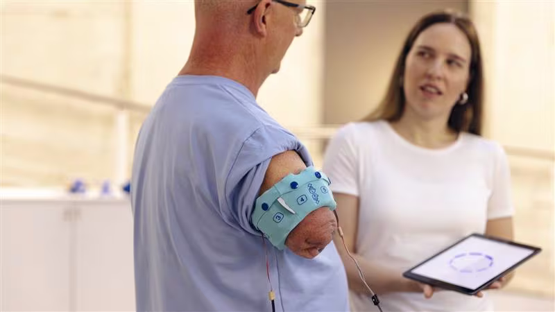 Arm amputee undergoing rehabilitation exercises.