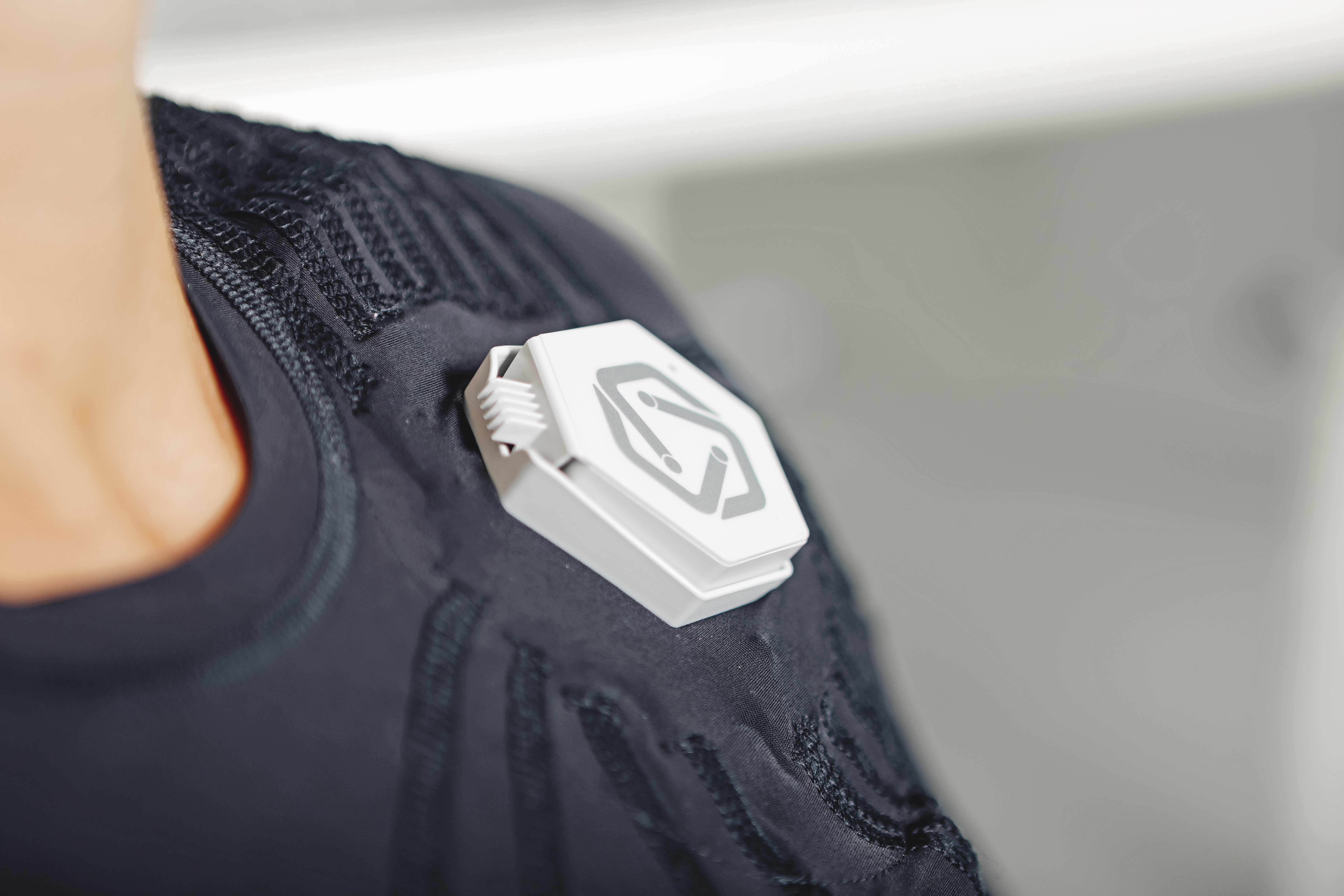 Close-up of the exopulse suit control unit on the upper body.