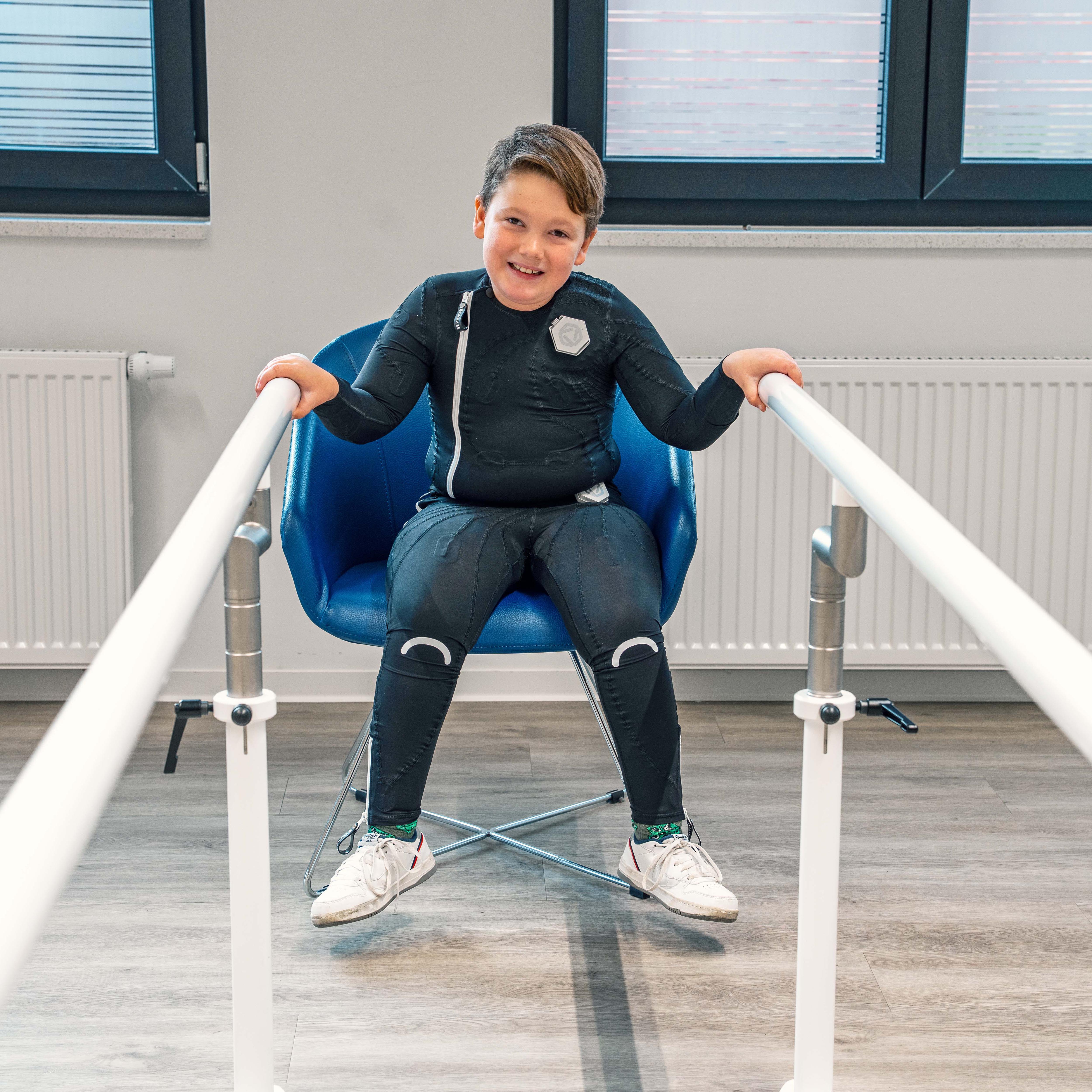 A child with cerebral palsy sitting on a chair