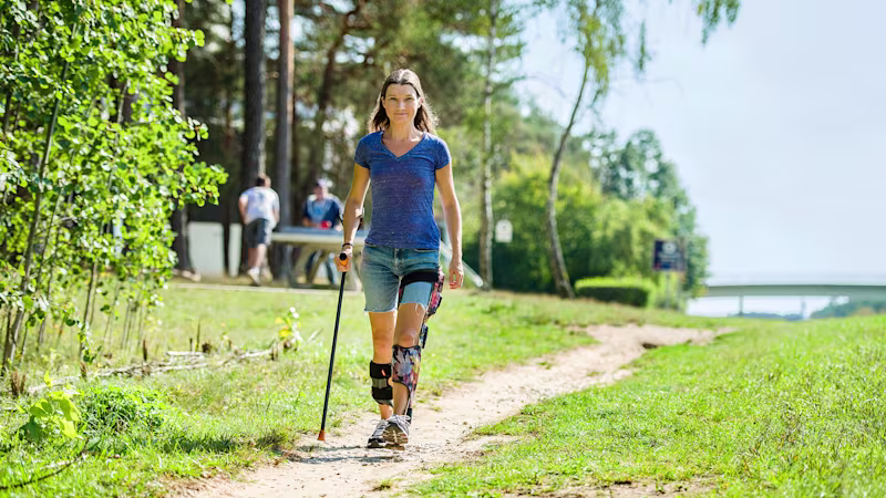 Woman walks with an E-MAG Active.