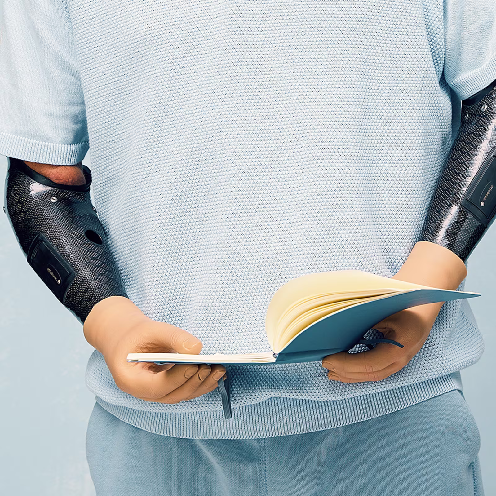 Prosthetic user holding a book