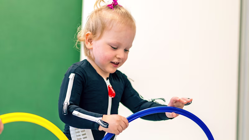 Cerebral palsy patient playing in the Exopulse Mollii Suit