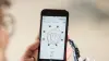 A female individual uses her smartphone to activate the Myo Plus app and optimize the movements of her bebionic hand