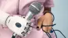 An Ottobock bionic hand grips a microphone 