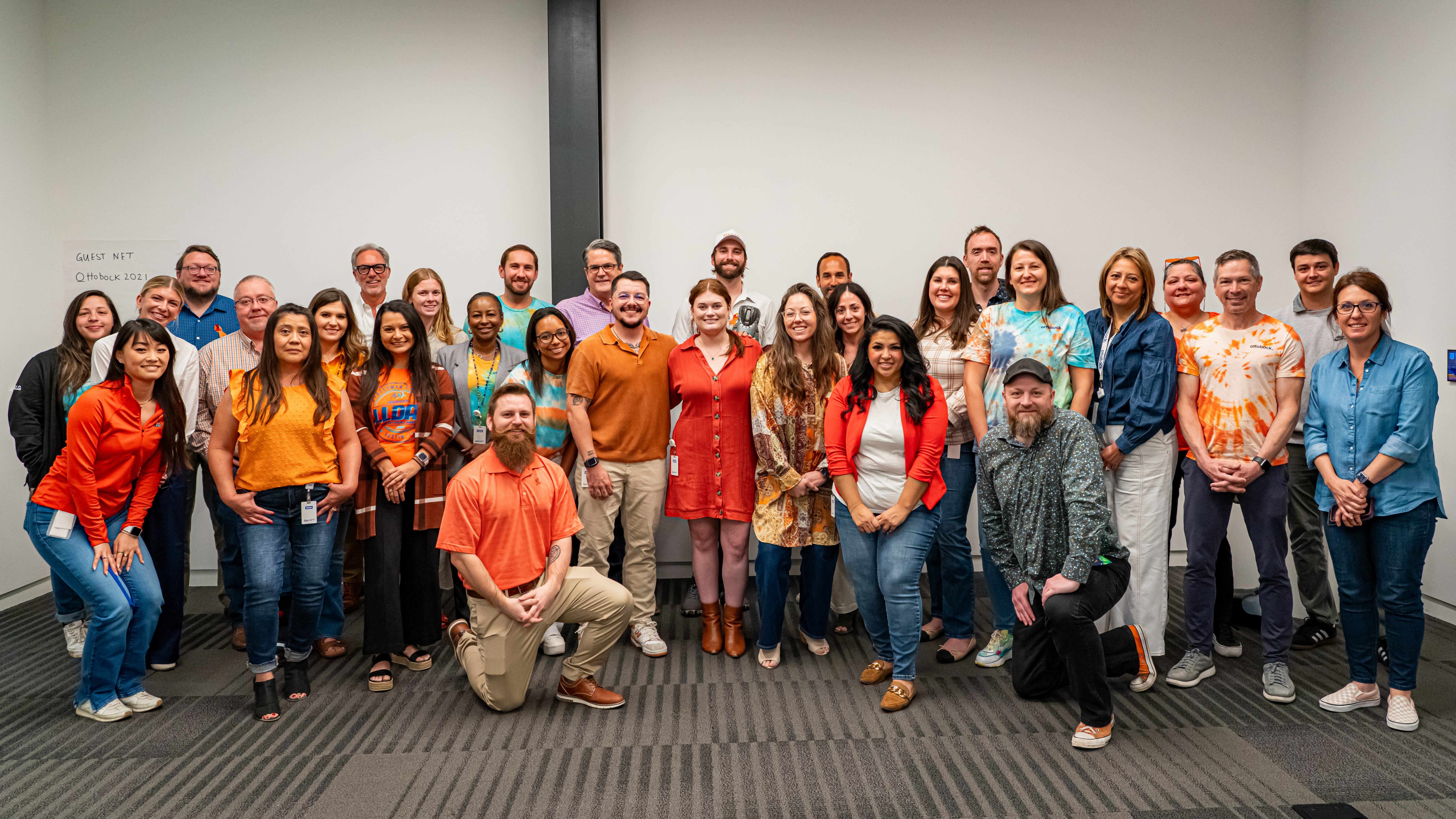 Several Ottobock employees dress in orange to spread awareness for limb loss and limb difference