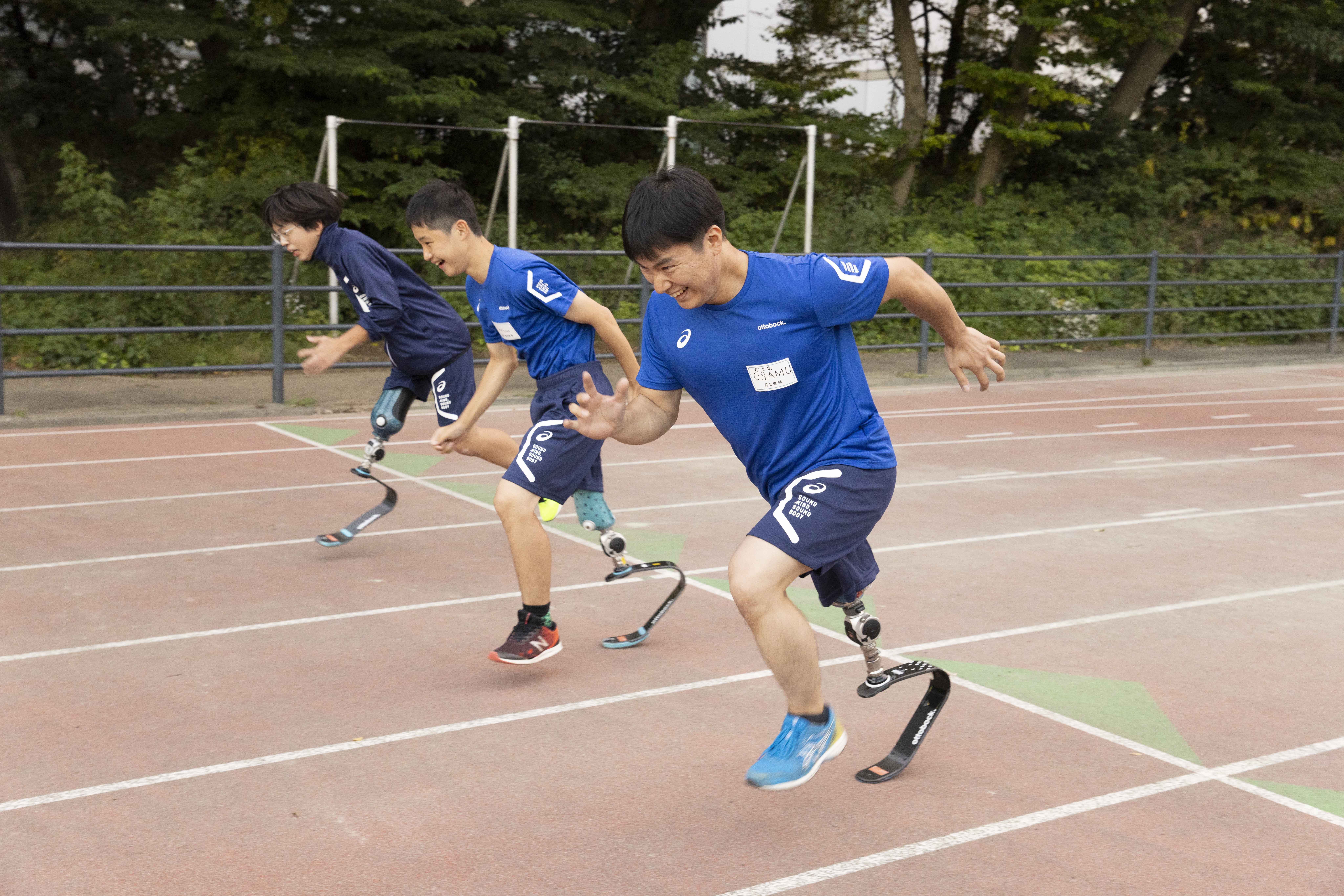 Various para athletes racing on a running track