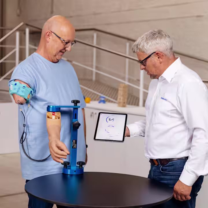 Ralf using the speedhand myoelectric prosthetic hand in daily activities, demonstrating flexibility and ease of use.