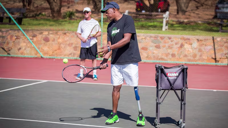 Patrick plays tennis with a 3R80