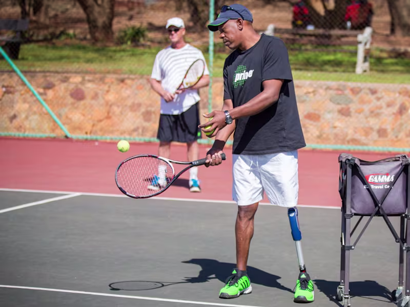 Patrick plays tennis with a 3R80