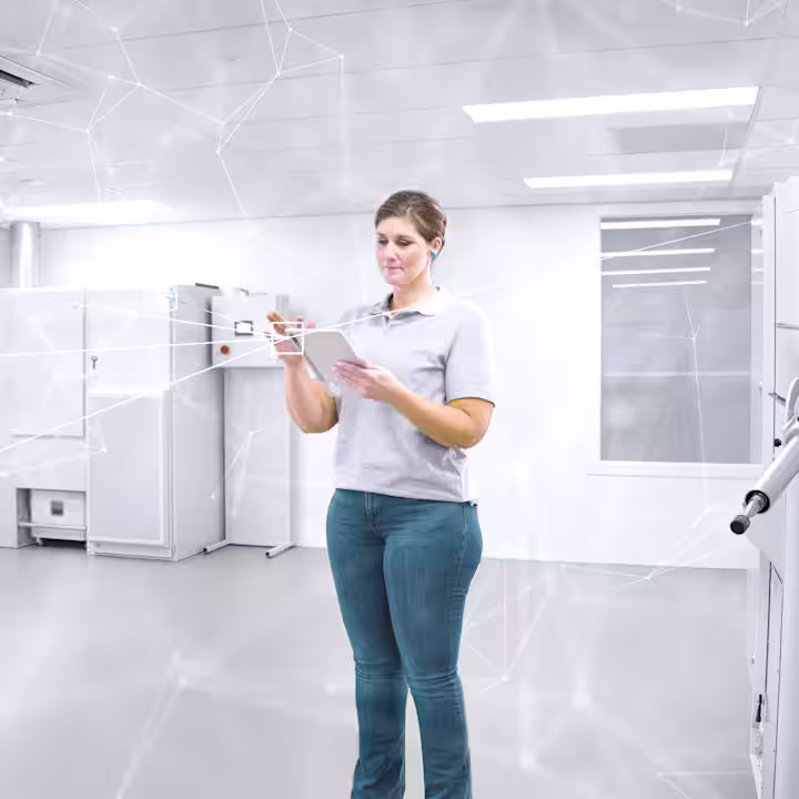 A lab technician tinkering with iFab technology