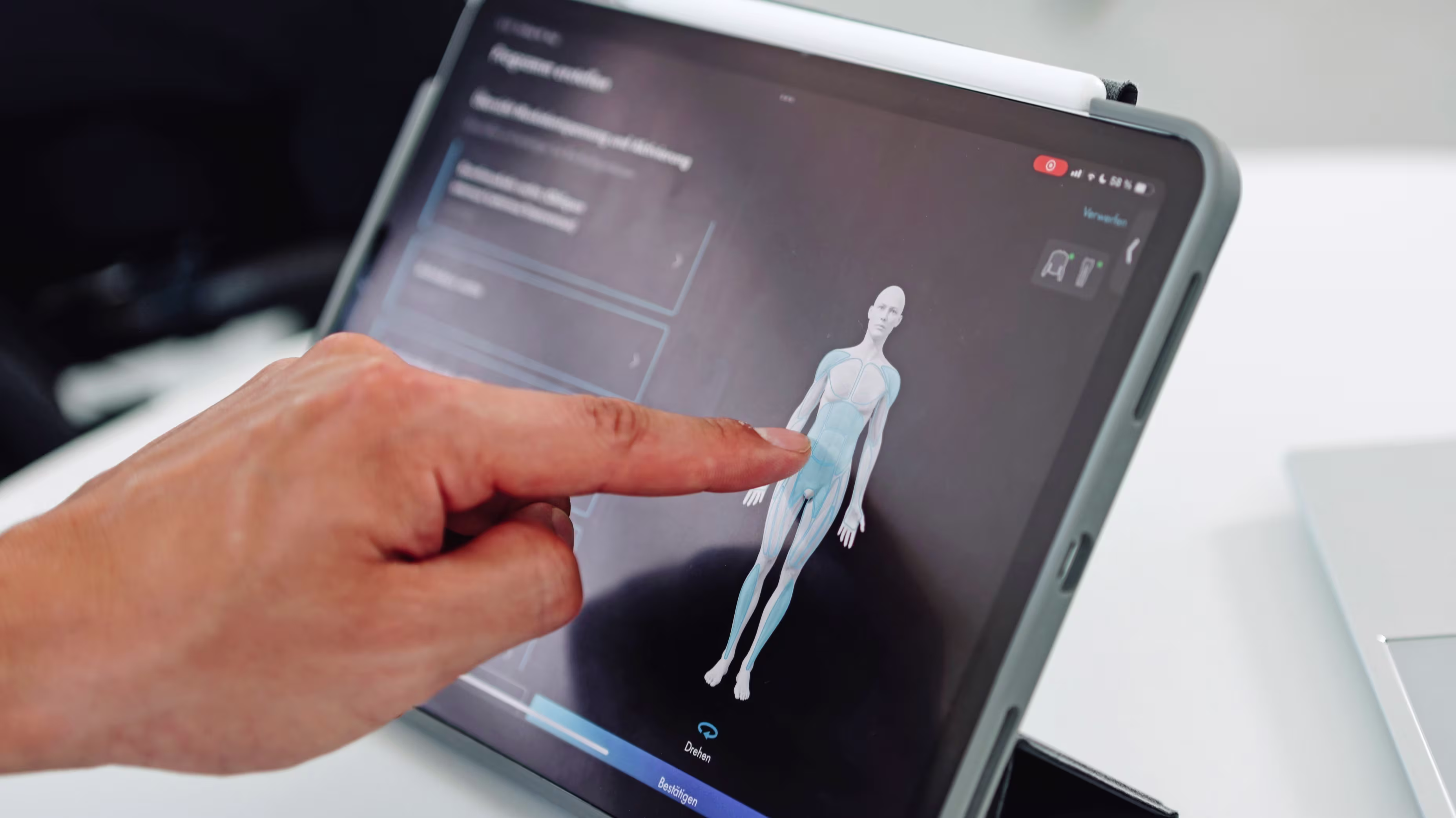 A hand is using the clinician app for the exopulse suit.