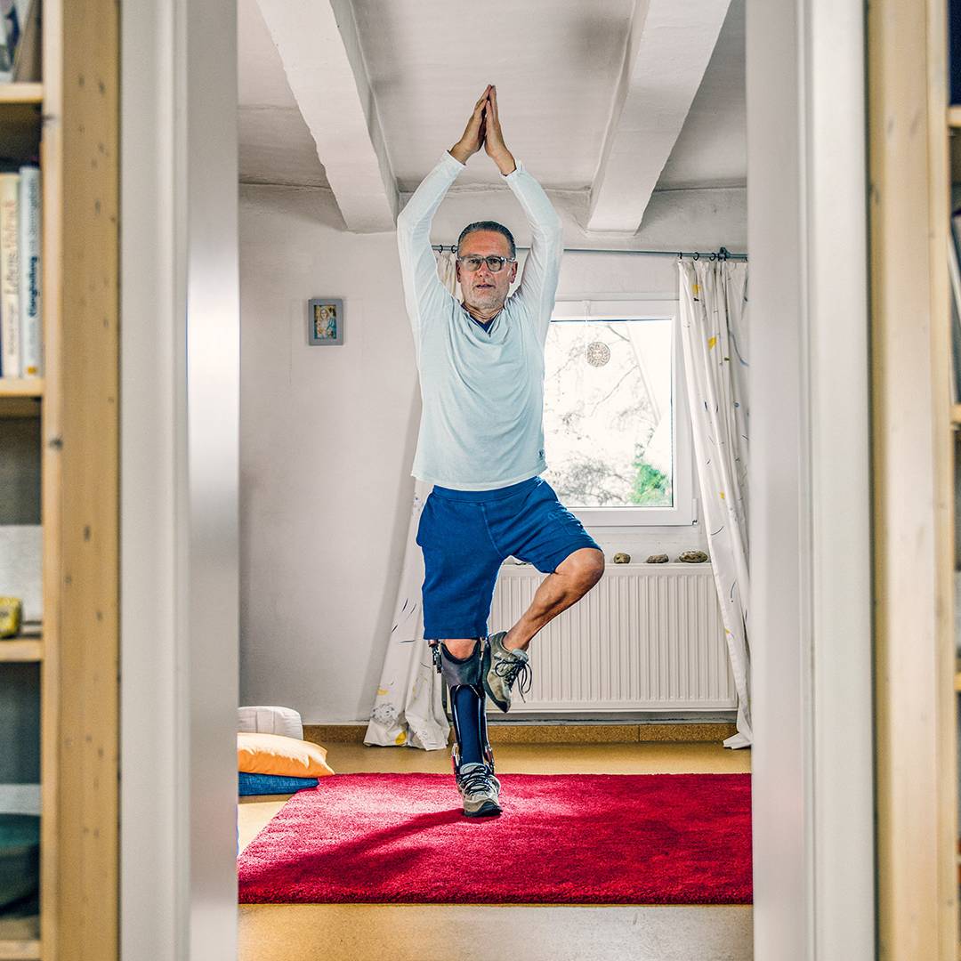 Ottobock C-Brace orthosis user practising Yoga.