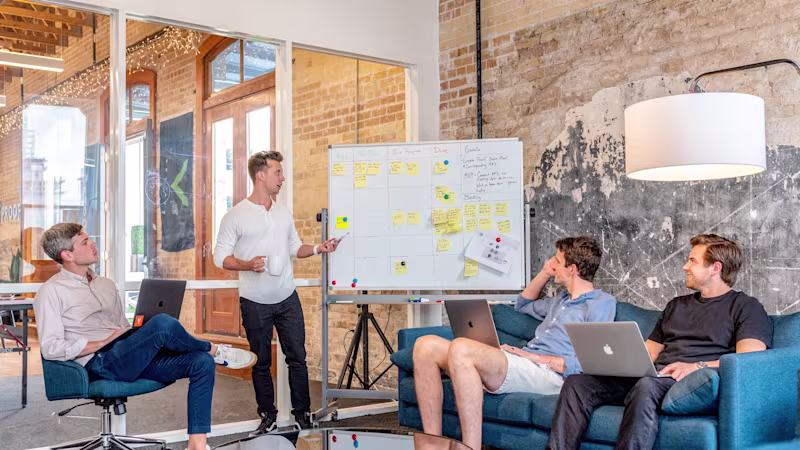 A group of professionals brainstorming in an office