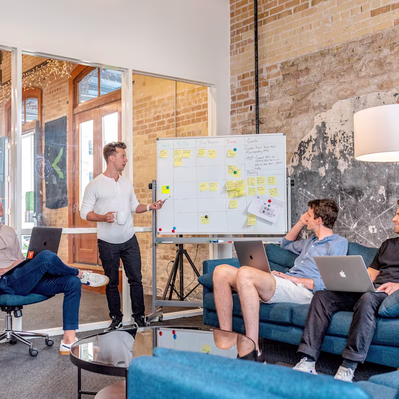 A group of professionals brainstorming in an office