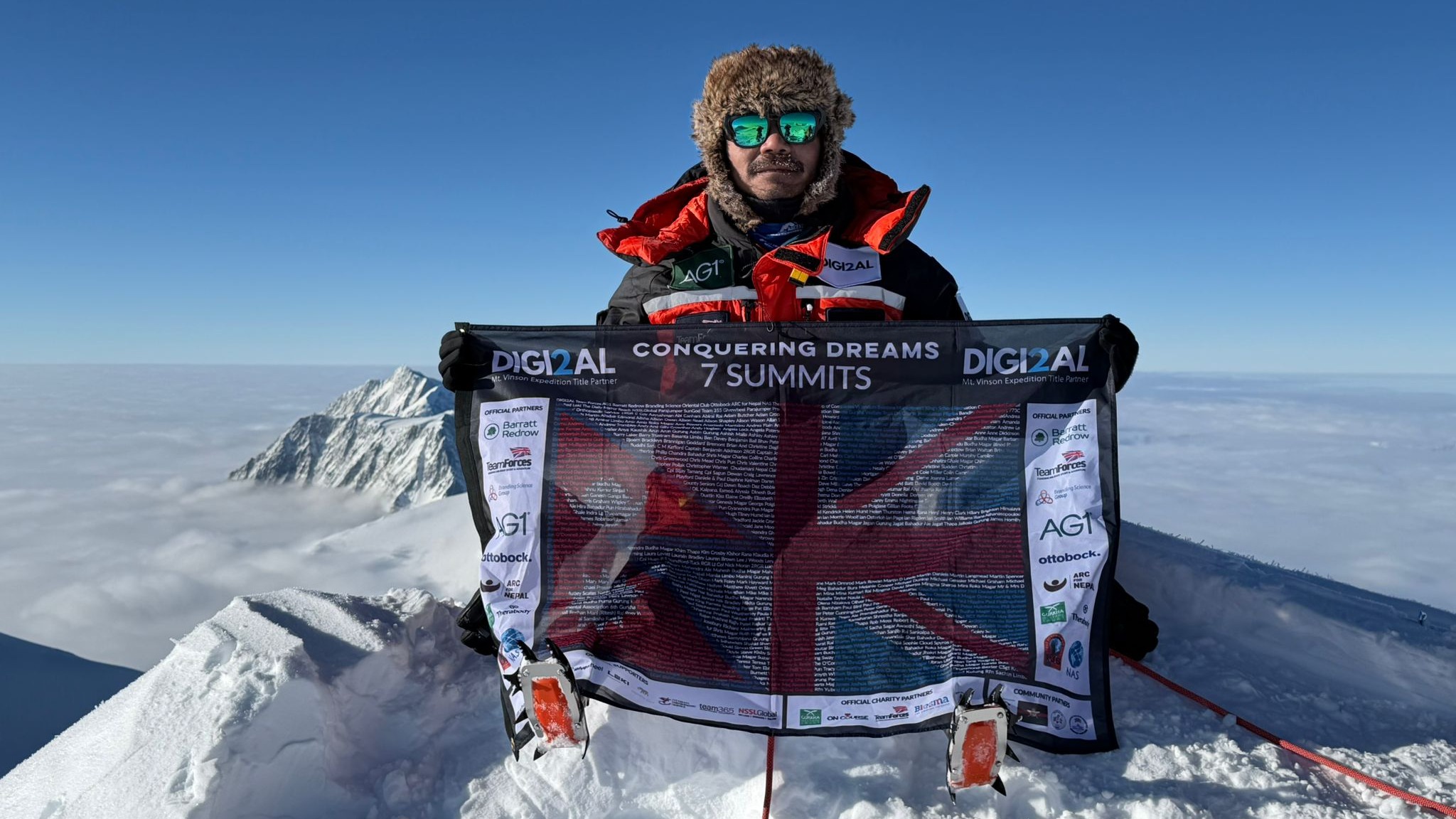 Hari showing a flag of his Seven Summits mission. (c) Ottobock