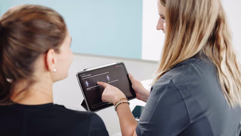 Healthcare professional explains the set-up in the exopulse suit app.