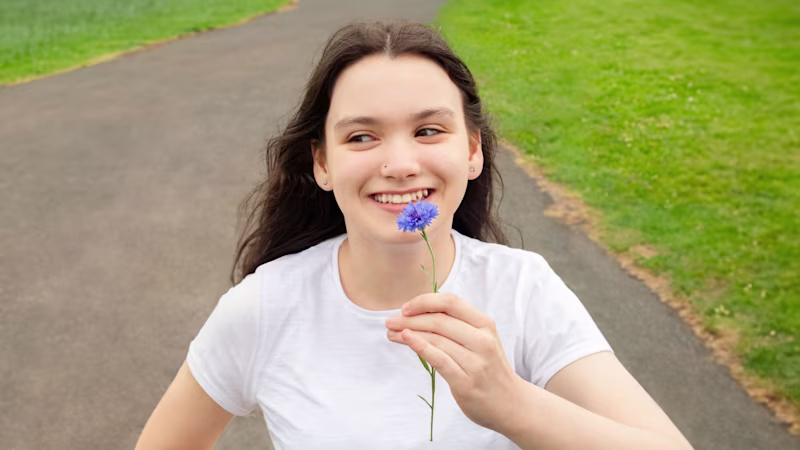 Cerebral Palsy patient is outside in the park