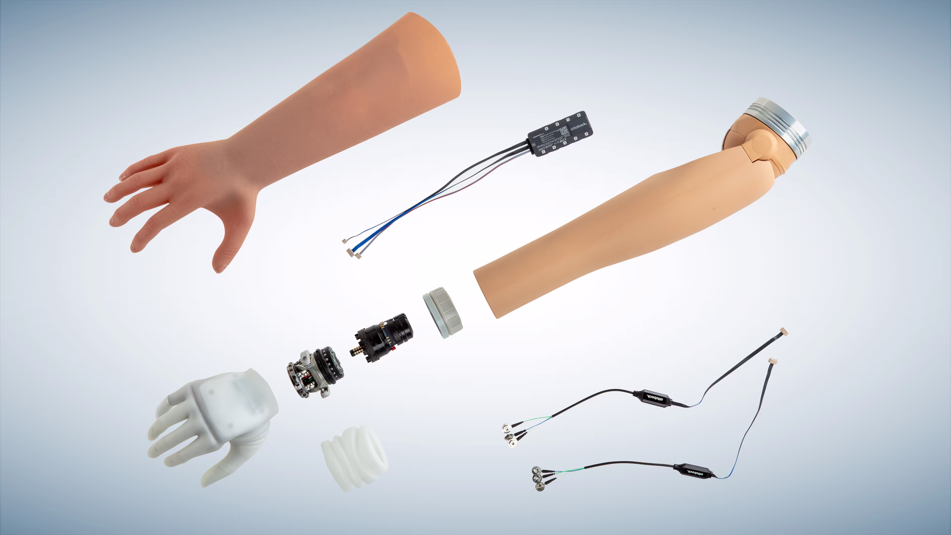 A product composition showing the michelangelo hand, matching glove, modular wrist, DynamicArm, myosmart plus, and the connectgrip app.