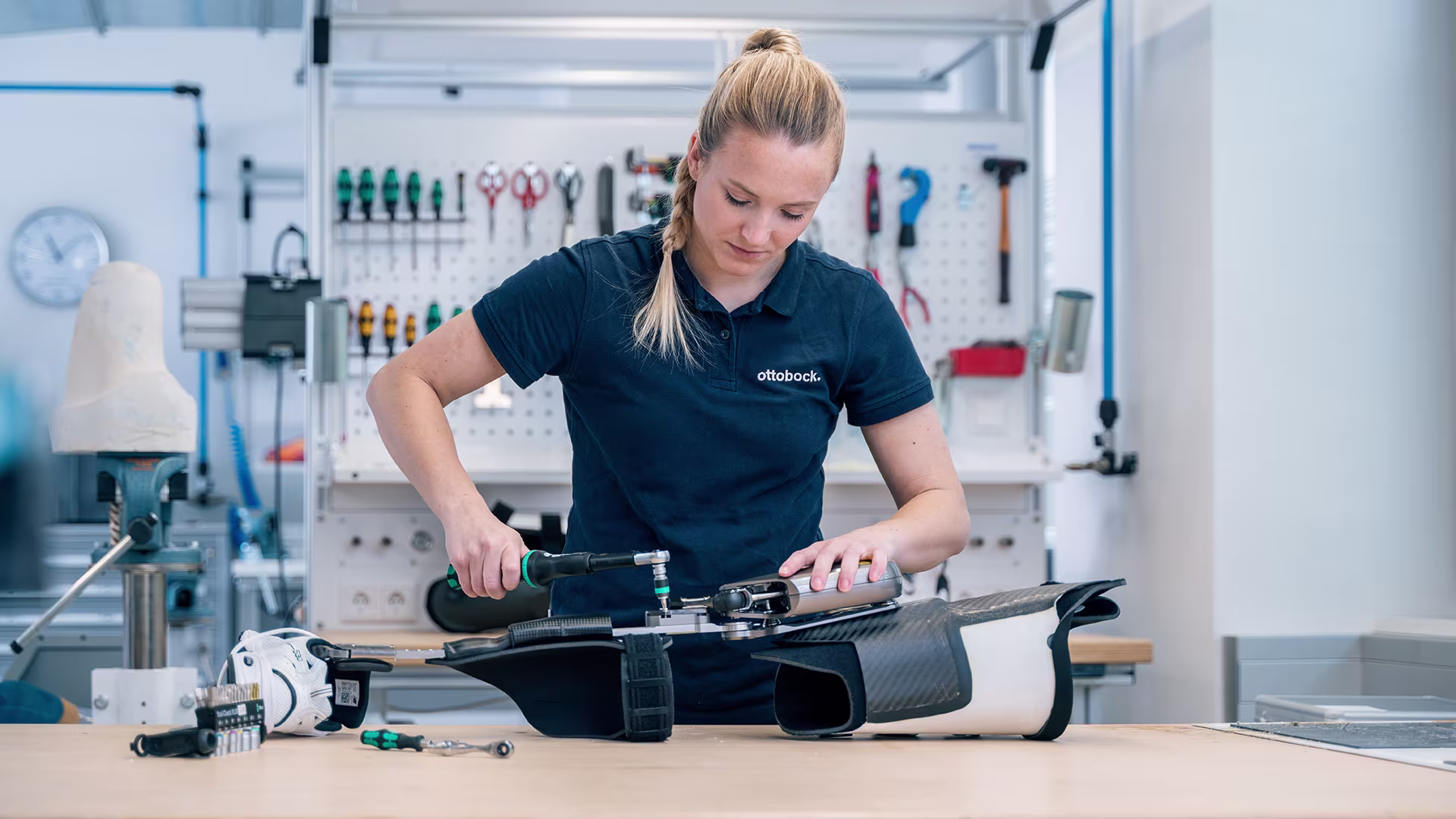 A Certified Orthotist working on a leg brace 