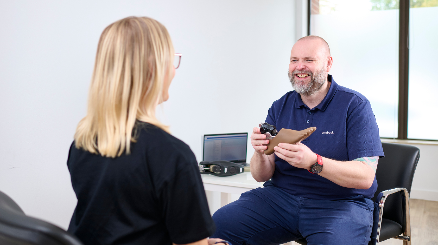 Ottobock UK Academy Clinician Scott Kilby holding a Taleo Adjust heel height adjustable prosthetic foot. 