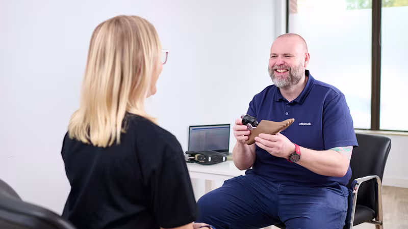 Ottobock UK Academy Clinician Scott Kilby holding a Taleo Adjust heel height adjustable prosthetic foot.