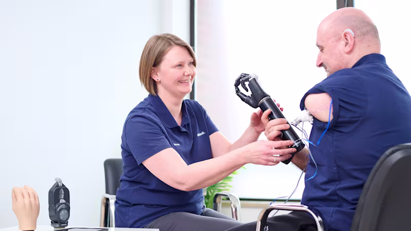 Ottobock UK Academy Clinician Morven McAlinden fitting a bebionic prosthetic hand to an upper limb amputee.