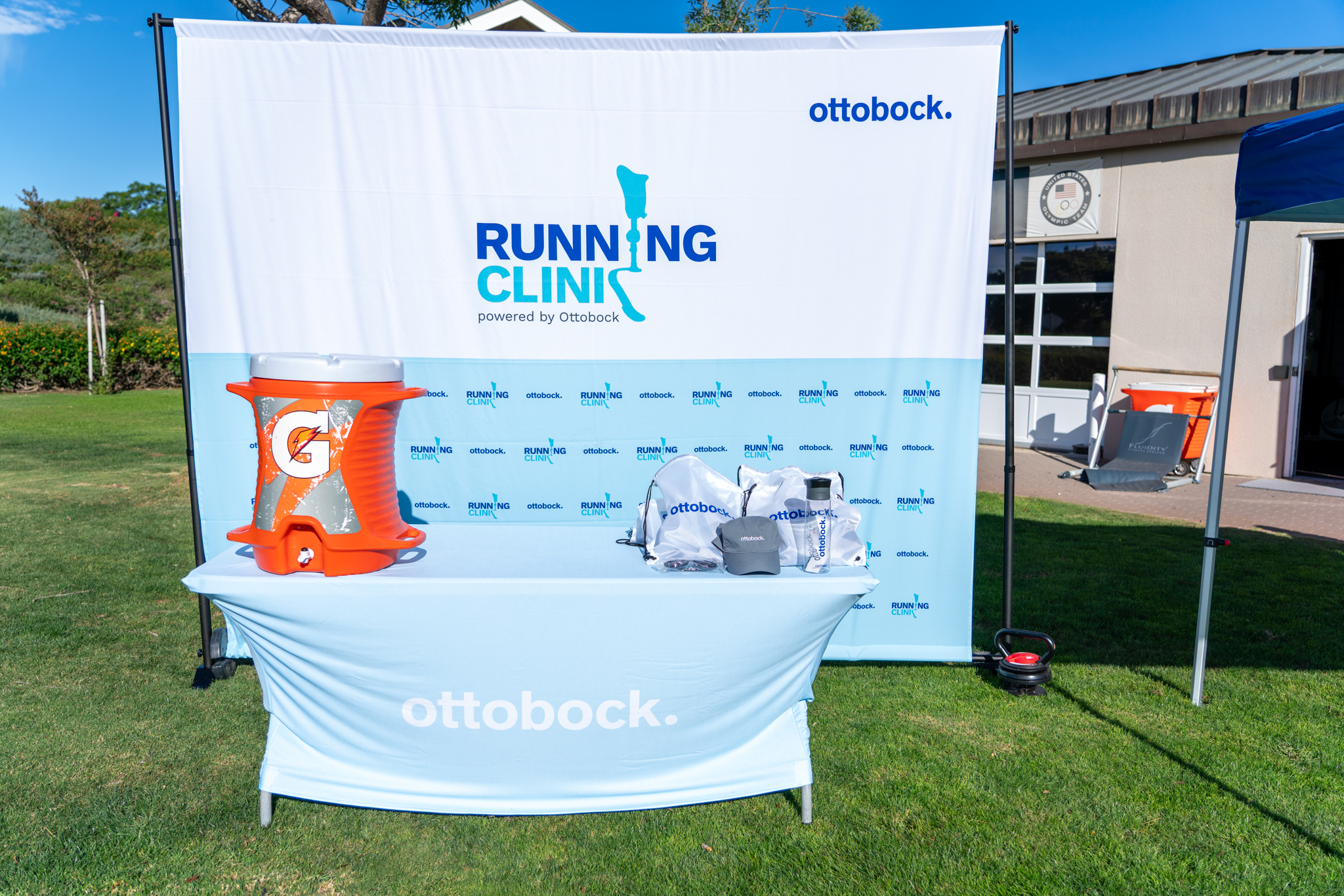 A water station with Ottobock signage at the Running Clinic in Chula Vista, CA