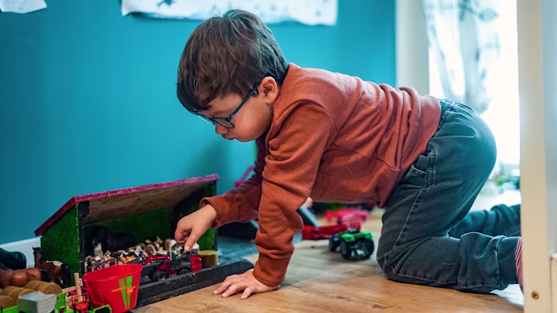 Cerebral palsy patient playing with his toys