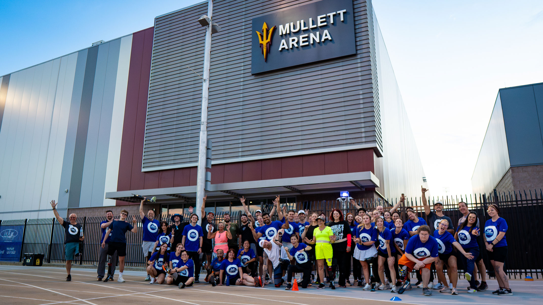 Full Circle Movement attendees, volunteers, and certified professionals huddle for a group photo