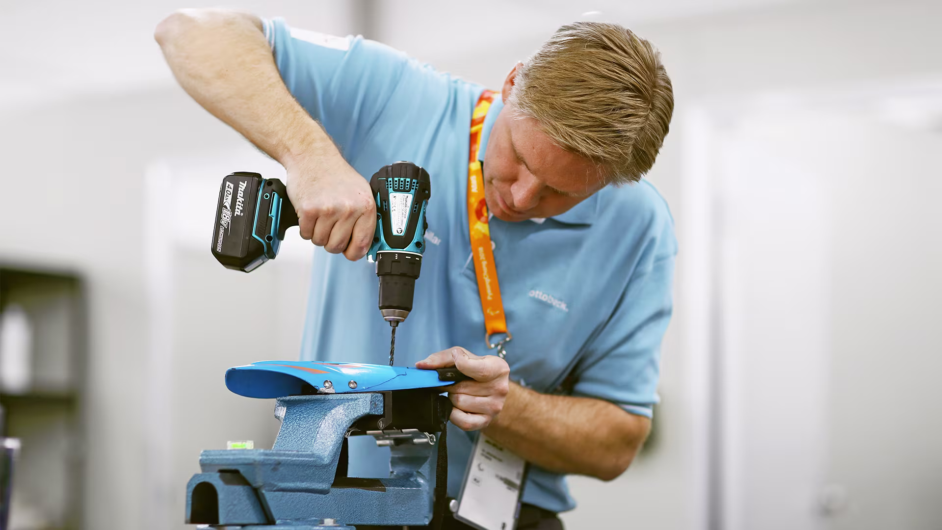 An Ottobock technician repairing an athlete's product at a competitive event