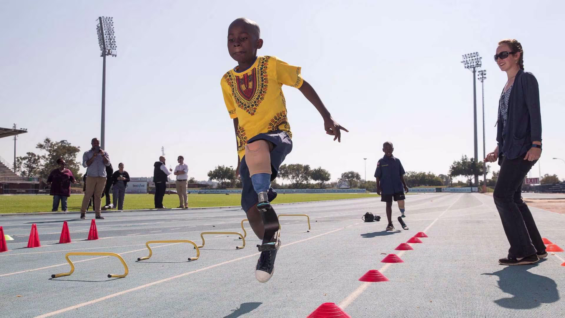 A boy jumps with a sport prosthesis